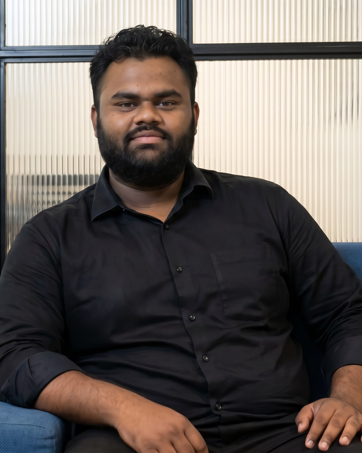 Lovepreet Singh seated in a black shirt